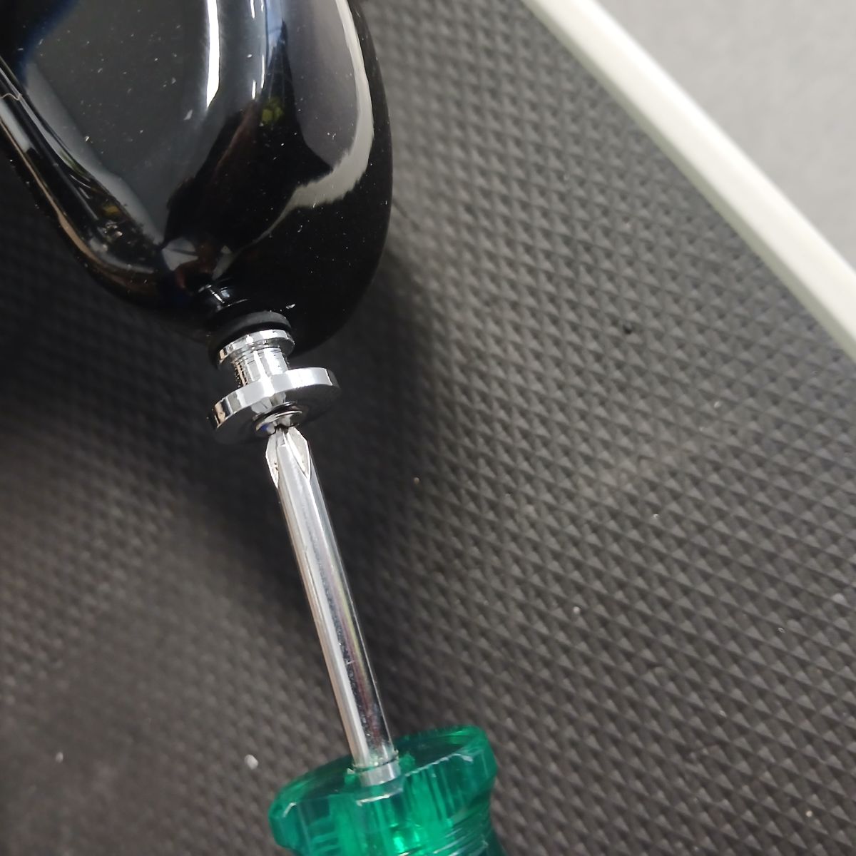 Unscrew the Strap Pin