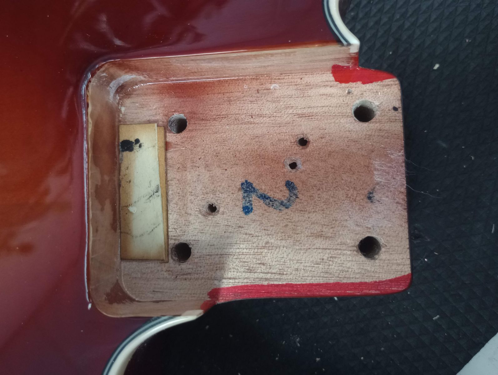 Screw holes on guitar body